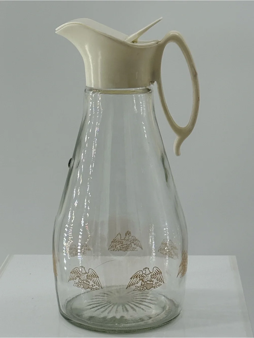 Glass Beverage Pitcher with Cream Lid and Gold Eagle Design